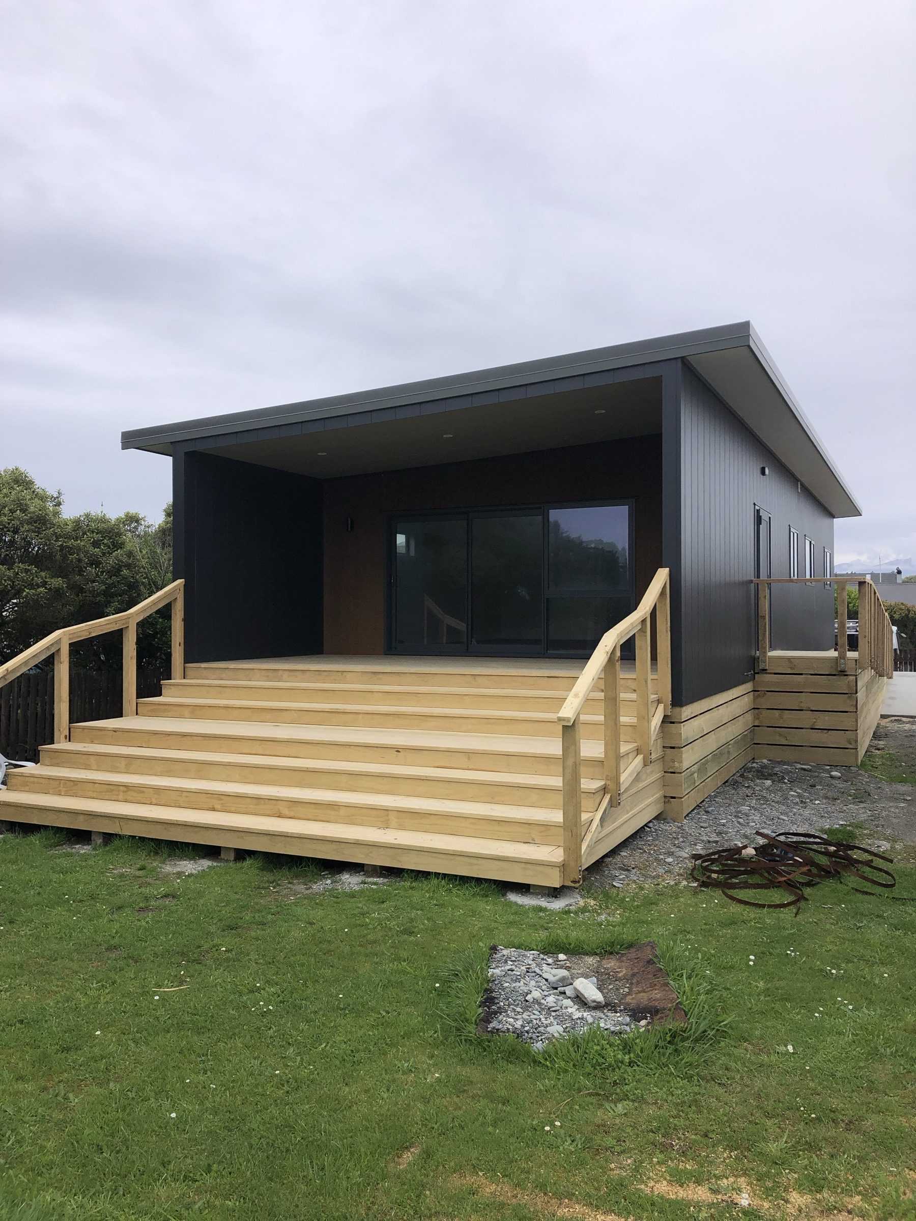 New build with timber deck and steps, West Coast