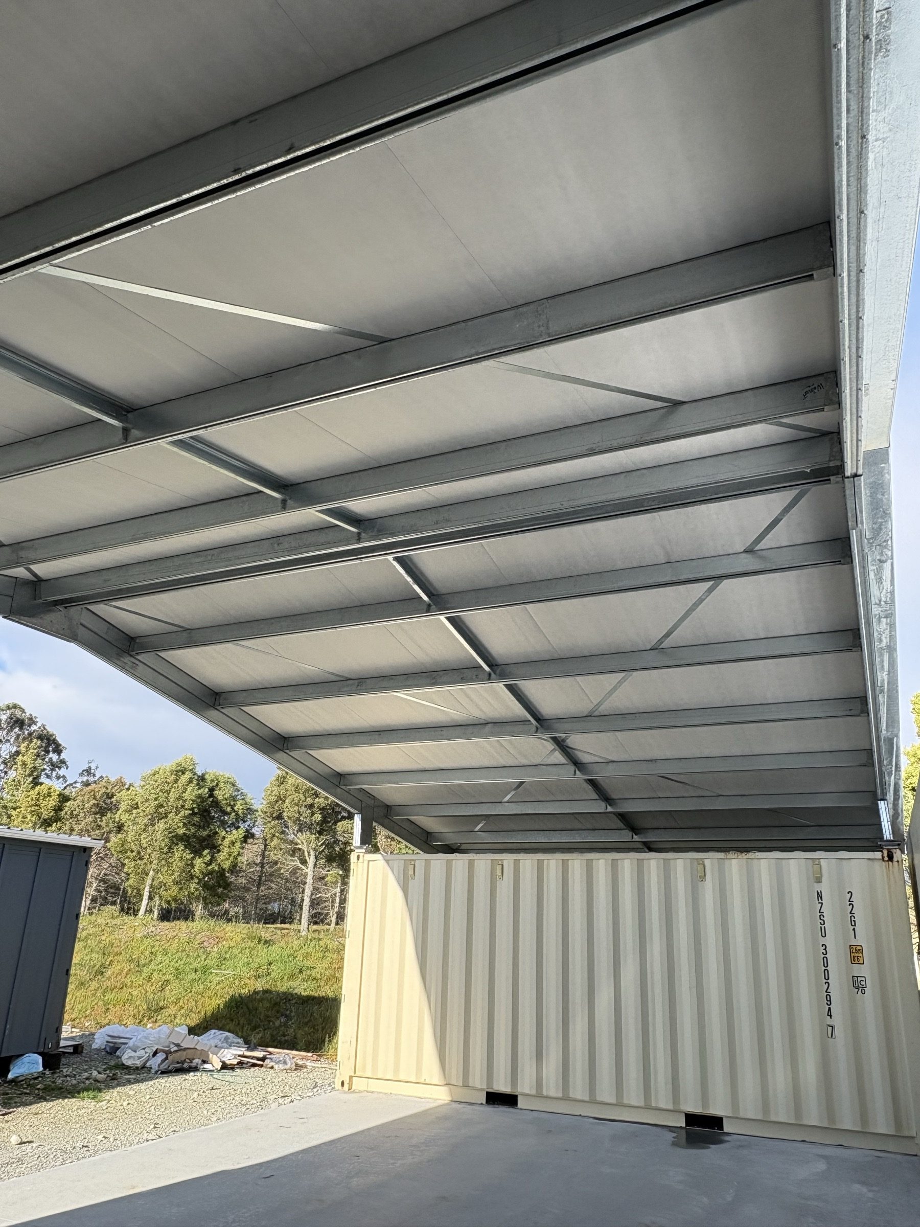Steel roof framing over containers
